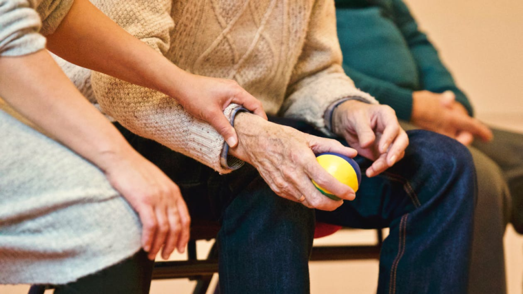 a person holding a stress ball