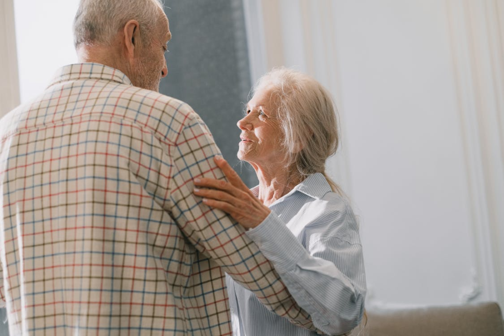 an-elderly-couple-dancing-together.webp