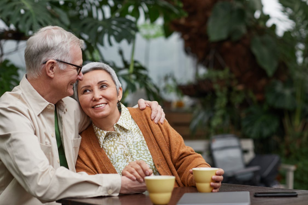 an elderly couple sitting together